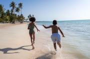 Children spending a joyful day by the sea at Playa Esmeralda in Miches.