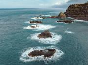 Rock formations rising from the ocean waters off Playa Esmeralda, Dominican Republic.